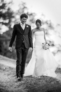 Bride and groom walking hand in hand
