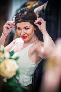 heidi adjusting hair at the mirror