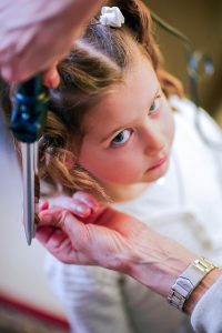 kid having the hair done